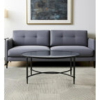 HomeRoots 45 Clear and Black Glass and Metal Oval Coffee Table - 19 H x 45 W x 25 D